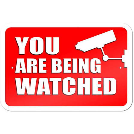 Red warning sign reading 'You Are Being Watched' with a silhouette of a surveillance camera